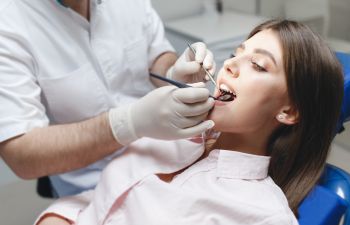 A woman undergoing dental checkup.